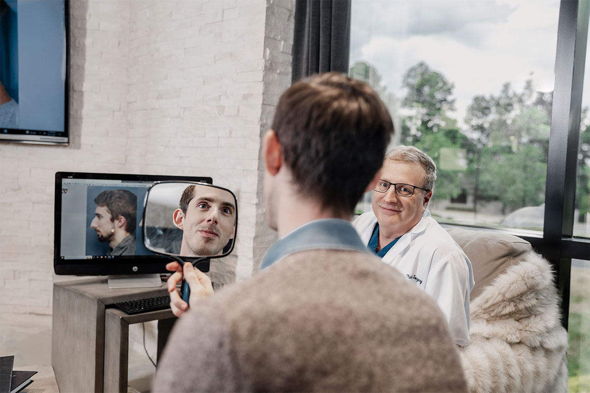 Dr. Stein meets with a patient post rhinoplasty in Raleigh